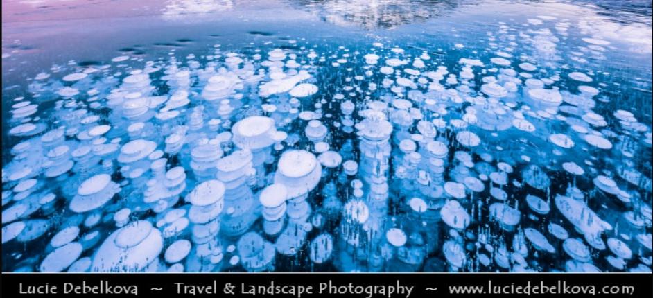 probable methane bubbles frozen in layers at Lago Bianca Switzerland